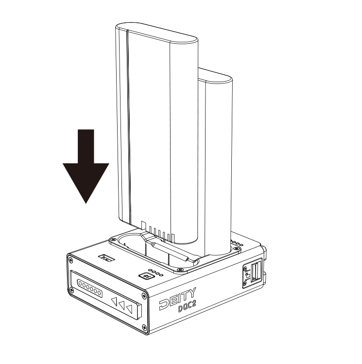A DEITY S-95 smart battery being inserted straight down into a DQC2 charging slot