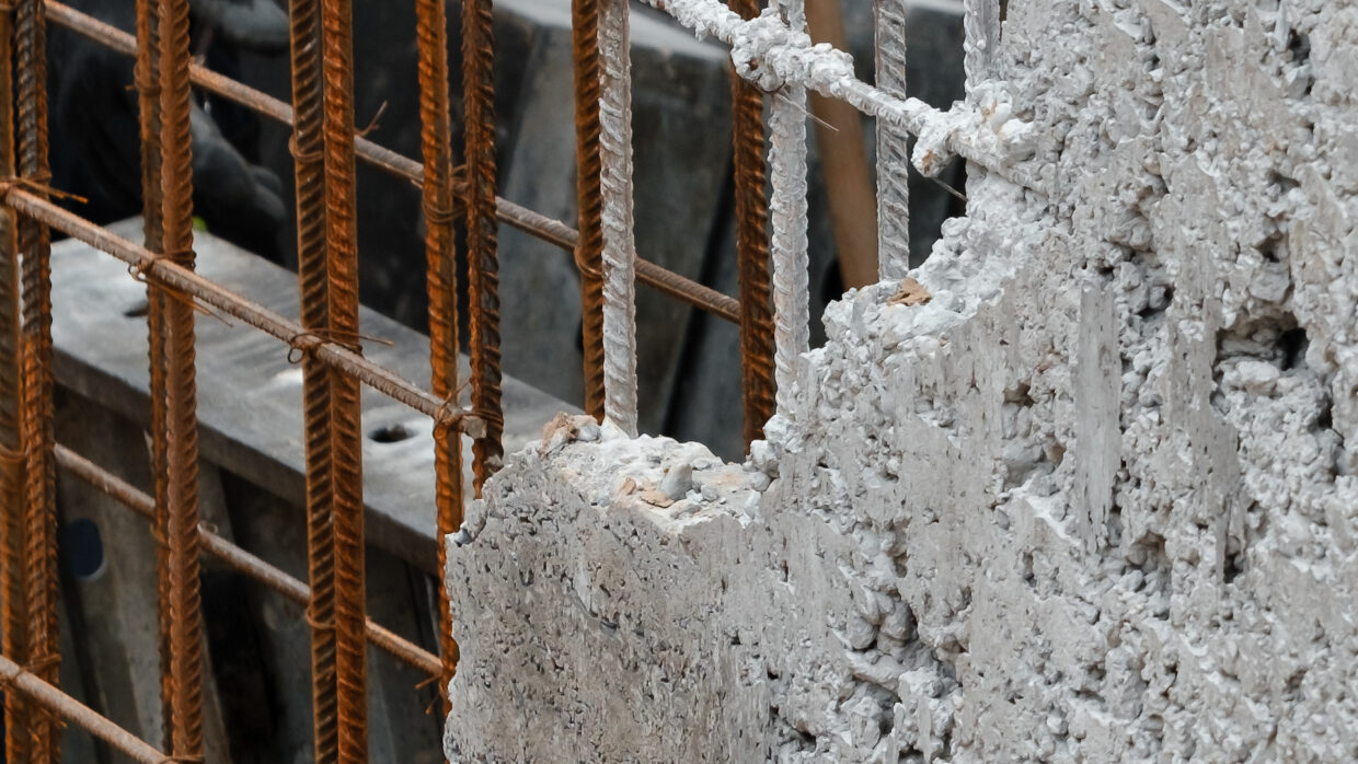 rusty rebar in wall blocking UHF audio signals